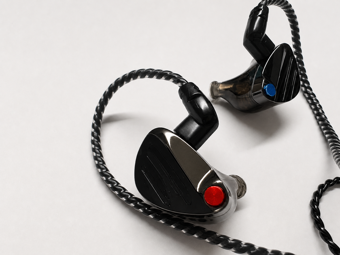 Close-up of black TinHiFi HUO in-ear monitors